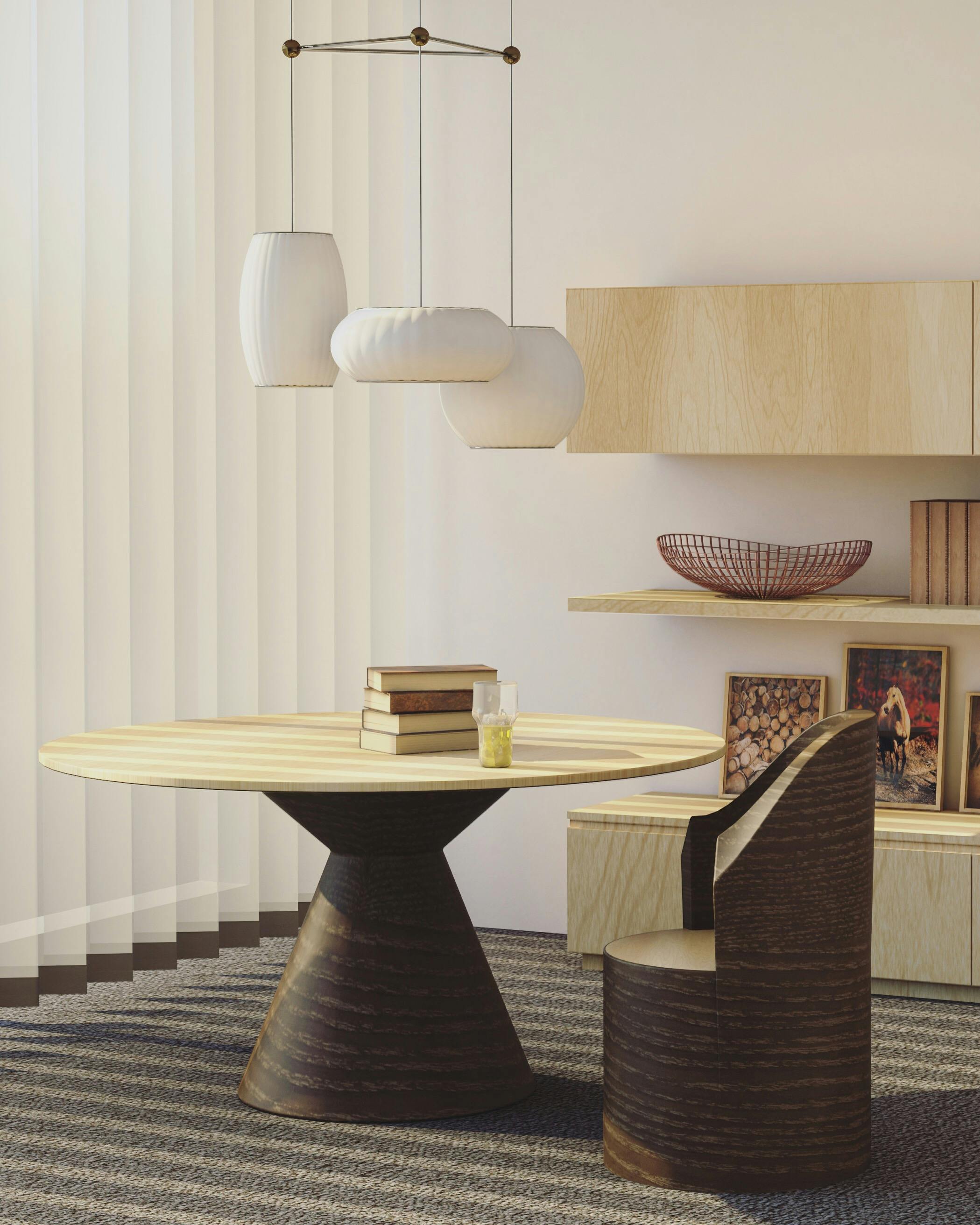 Stylish dining space with round table and pendant lights